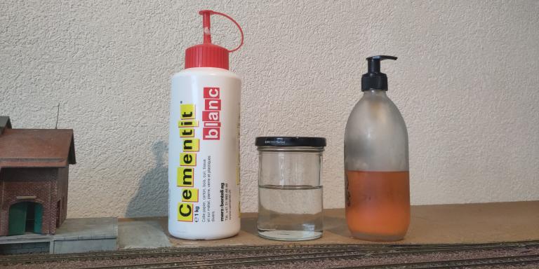 Glue and water mix for track ballasting